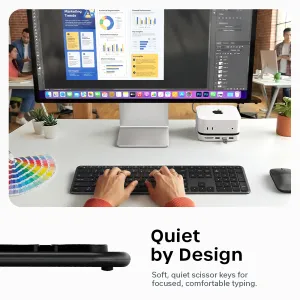 Satechi EX3 Slim kabellose Tastatur mit Nummernblock, auf einem Schreibtisch gezeigt, mit tippenden Händen und Seitenansicht