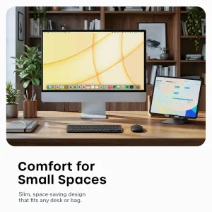 Satechi EX1 Slim trådløst tastatur i stellarsvart på et hjemmekontorskrivebord med skjerm og nettbrett