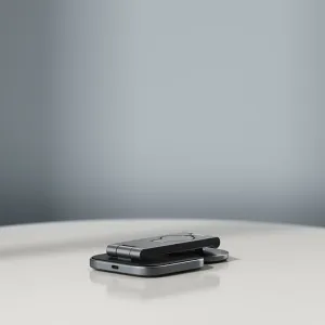 Satechi 3-in-1 foldable Qi2 charging stand in space grey, shown folded with MagSafe-style alignment pad