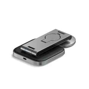 Satechi 3-in-1 foldable Qi2 charging stand in silver and black, shown partially folded with a circular charging pad