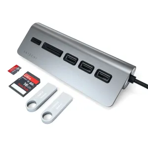 Satechi USB-C -USB-keskitin ja kortinlukija alumiinia, jossa on USB-portteja, korttipaikkoja ja muistikortteja valkoisella taustalla