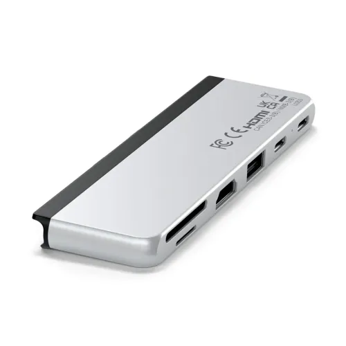 Dual USB-C hub in silver for Surface Pro 9, oblique view with SD and microSD slots, HDMI, USB-A and two USB-C connectors.