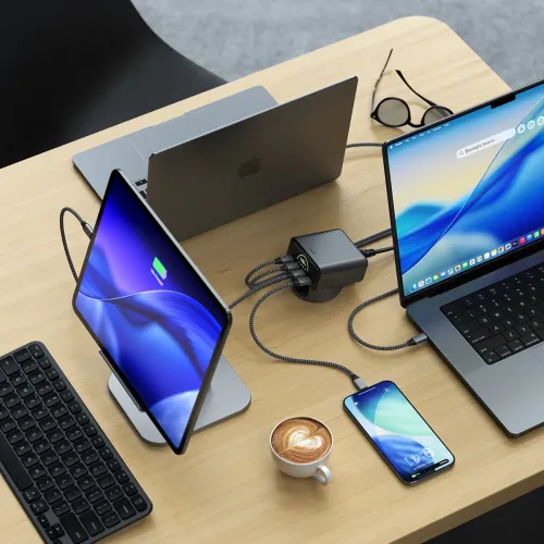 Satechi ChargeView 140W desktop charger with real-time wattage display, charging multiple USB-C devices on a desk