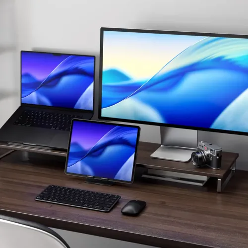 Satechi EX1 Slim wireless keyboard with Nordic layout on a desk in a multi-device workspace
